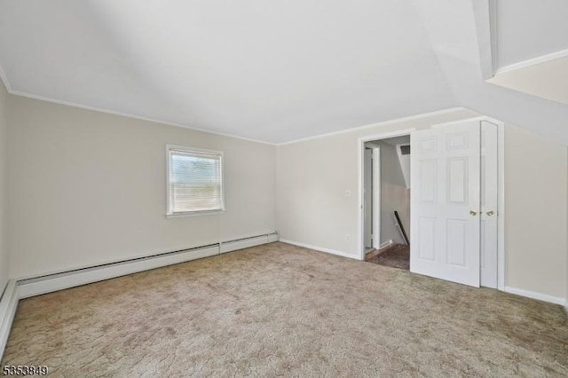 interior space with ornamental molding, a baseboard heating unit, and lofted ceiling