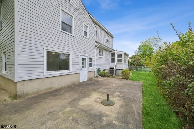back of house with a patio and entry steps