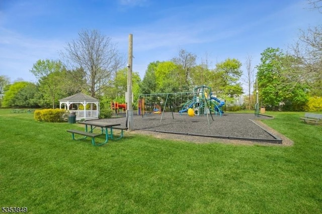 community jungle gym featuring a lawn and a gazebo