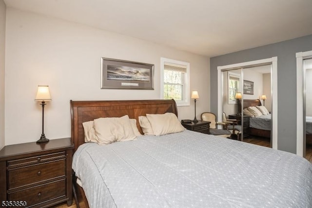bedroom with wood finished floors