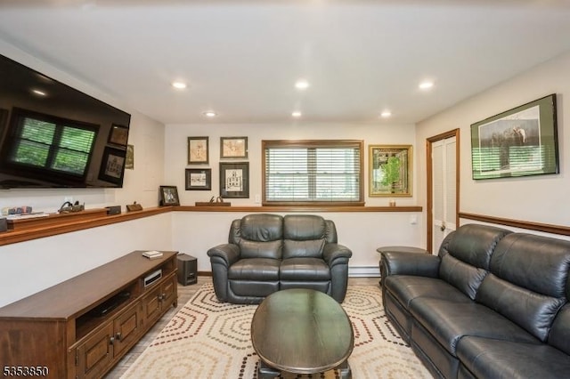 living room featuring baseboards, a baseboard radiator, and recessed lighting