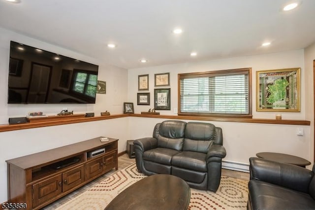 living area featuring recessed lighting, a baseboard radiator, and light wood finished floors