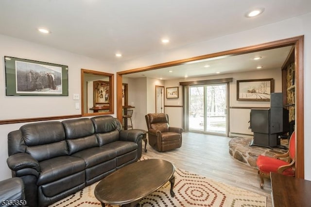 living room featuring light wood-type flooring and recessed lighting