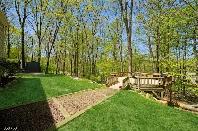 view of yard with a deck