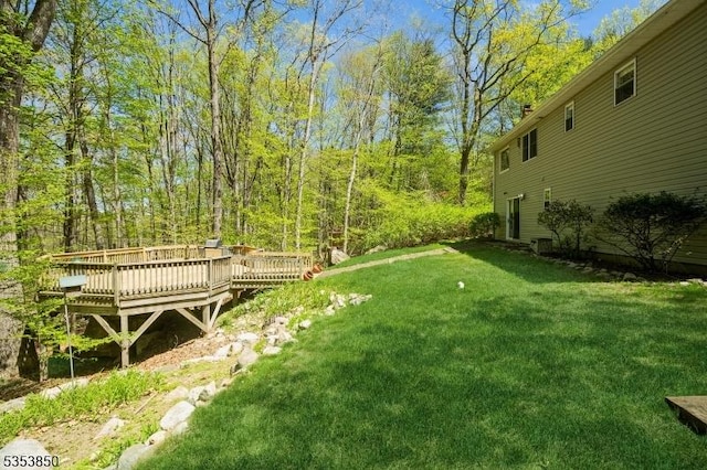 view of yard with a deck