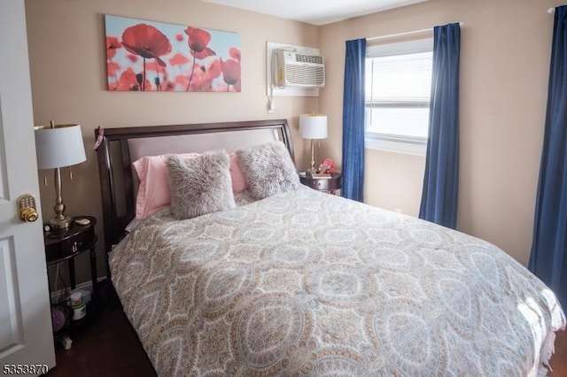 bedroom featuring a wall mounted air conditioner