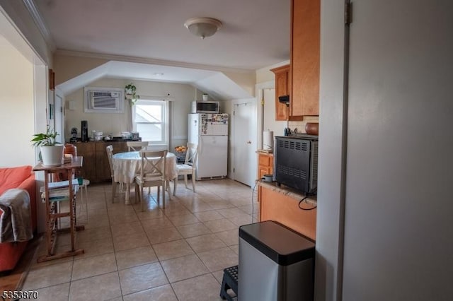 dining space with crown molding, a wall mounted AC, and light tile patterned floors