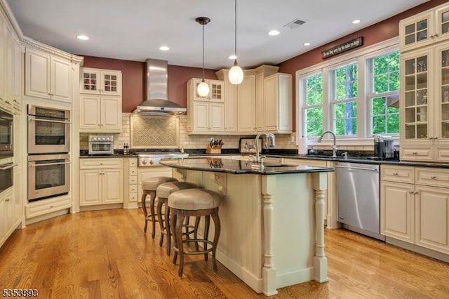 28 Arbor Rd, North Caldwell Boro, NJ 07006 - kitchen featuring stainless steel appliances, wall chimney range hood, dark countertops, a sink, and recessed lighting