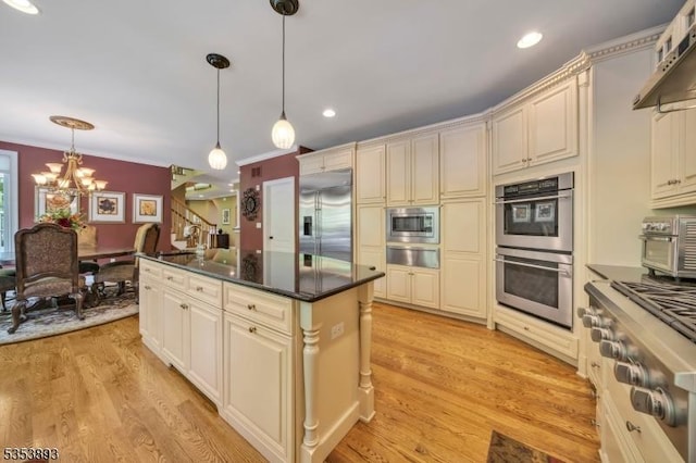 28 Arbor Rd, North Caldwell Boro, NJ 07006 - kitchen with built in appliances, cream cabinets, a chandelier, recessed lighting, and crown molding
