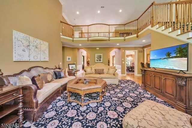 28 Arbor Rd, North Caldwell Boro, NJ 07006 - living room featuring a towering ceiling, recessed lighting, crown molding, and arched walkways