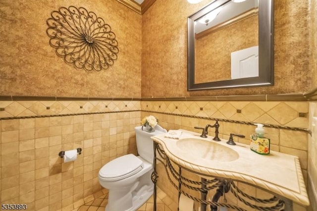 28 Arbor Rd, North Caldwell Boro, NJ 07006 - bathroom featuring toilet, wainscoting, vanity, tile patterned floors, and ornamental molding
