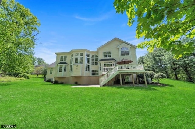 28 Arbor Rd, North Caldwell Boro, NJ 07006 - back of house with a wooden deck, stairway, and a lawn