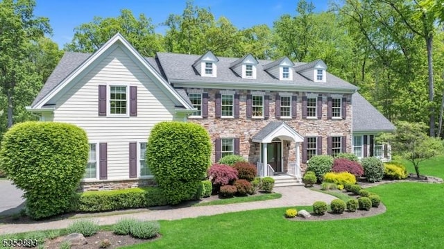 28 Arbor Rd, North Caldwell Boro, NJ 07006 - colonial home with stone siding and a front yard