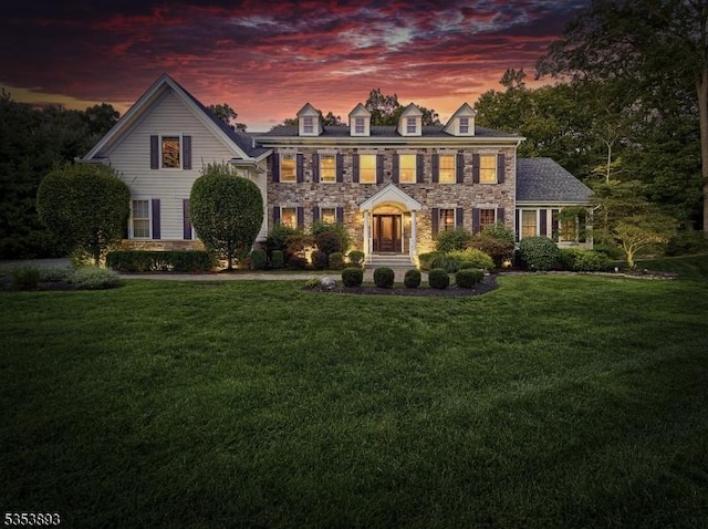 28 Arbor Rd, North Caldwell Boro, NJ 07006 - colonial inspired home featuring a front lawn and stone siding
