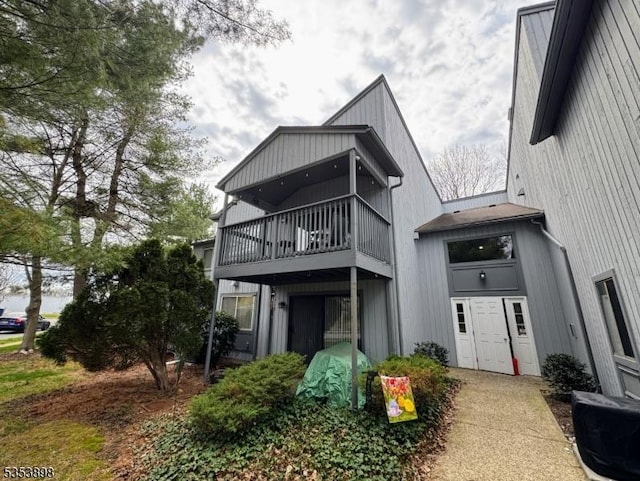 back of property with a balcony
