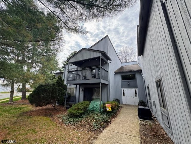 rear view of property with a balcony