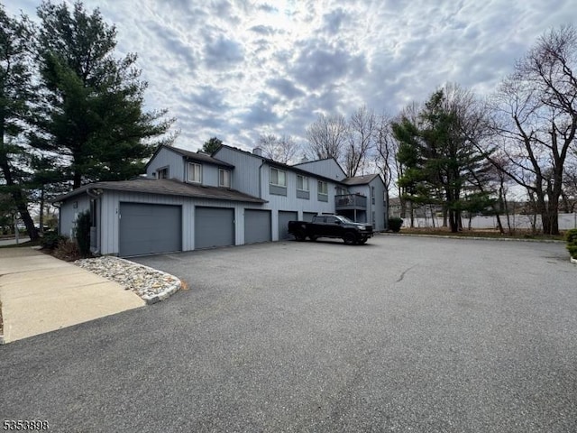 view of front of property with a garage and aphalt driveway