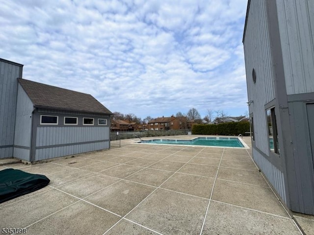 view of swimming pool featuring a fenced in pool and a patio