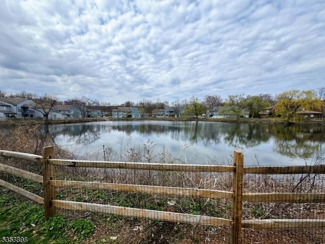 property view of water with fence