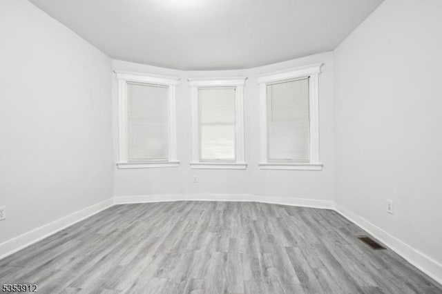 18 Ellis Ave, Irvington Twp, NJ 07111 - empty room with visible vents, baseboards, and wood finished floors
