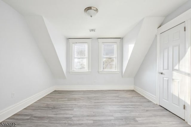18 Ellis Ave, Irvington Twp, NJ 07111 - additional living space with baseboards, light wood-style flooring, and visible vents