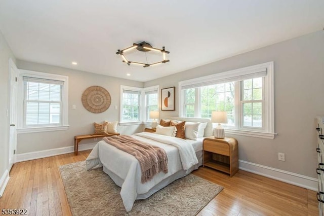 bedroom featuring recessed lighting, baseboards, and light wood-style floors