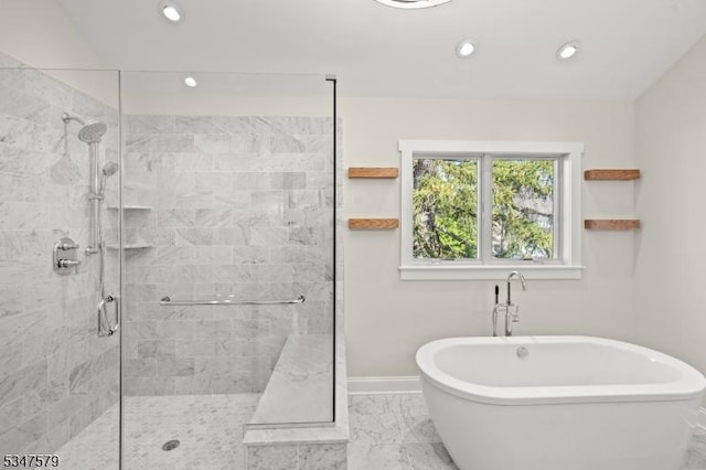 full bathroom with a shower stall, baseboards, marble finish floor, a soaking tub, and recessed lighting