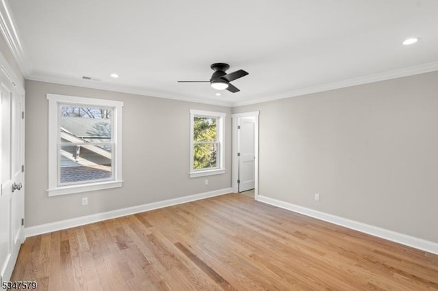 spare room featuring recessed lighting, baseboards, ornamental molding, and light wood-style floors