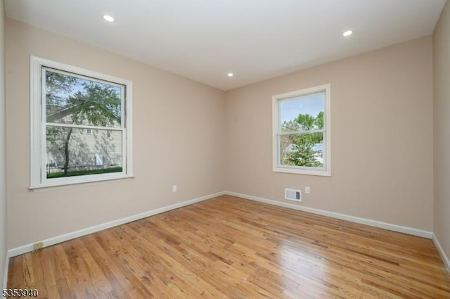 318 Sunnyside Ter, Bridgewater Twp, NJ 08807 - spare room featuring baseboards, visible vents, a wealth of natural light, and light wood-style flooring