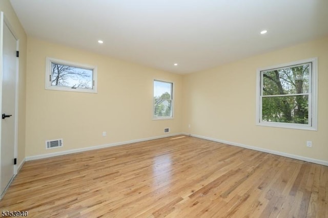 318 Sunnyside Ter, Bridgewater Twp, NJ 08807 - empty room featuring a healthy amount of sunlight, light wood-style floors, and visible vents