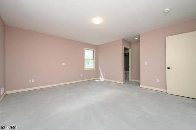 318 Sunnyside Ter, Bridgewater Twp, NJ 08807 - empty room featuring baseboards and concrete flooring