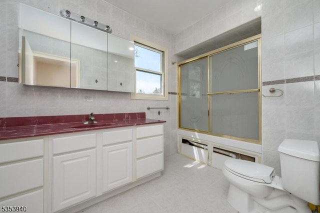 318 Sunnyside Ter, Bridgewater Twp, NJ 08807 - full bathroom with an enclosed shower, toilet, tile walls, and vanity