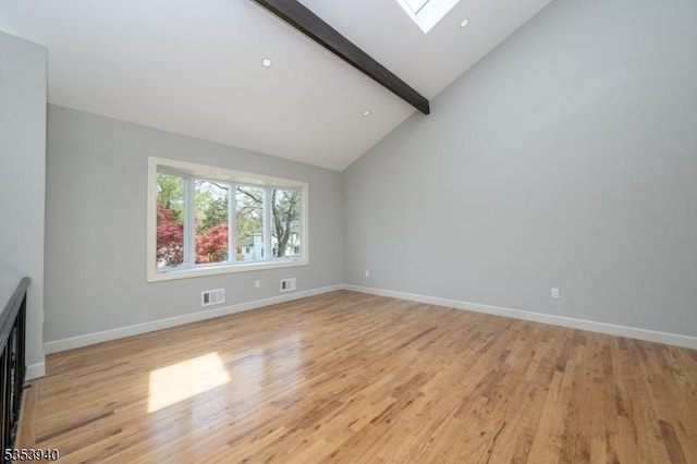 318 Sunnyside Ter, Bridgewater Twp, NJ 08807 - unfurnished living room featuring visible vents, vaulted ceiling with skylight, and light wood-style floors