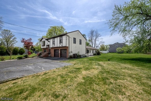 318 Sunnyside Ter, Bridgewater Twp, NJ 08807 - view of front of home with driveway, a front lawn, and a garage