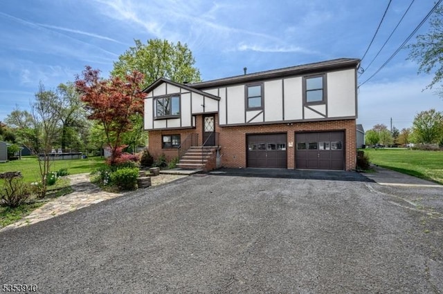 318 Sunnyside Ter, Bridgewater Twp, NJ 08807 - view of front of home with a garage, stucco siding, driveway, and brick siding