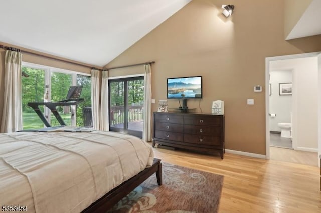 bedroom featuring access to outside, wood finished floors, high vaulted ceiling, and baseboards