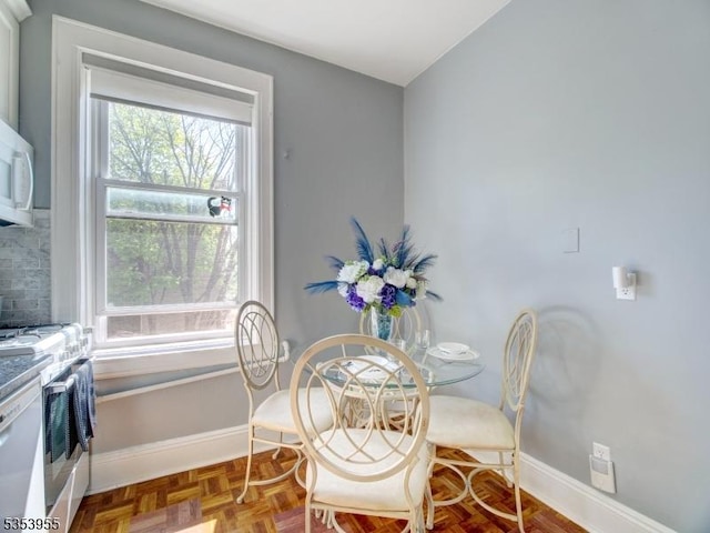 dining room featuring baseboards