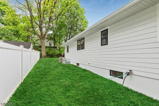 view of yard featuring central air condition unit