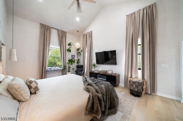 bedroom featuring ceiling fan, baseboards, high vaulted ceiling, light wood-style floors, and recessed lighting