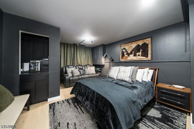 bedroom with light wood-type flooring