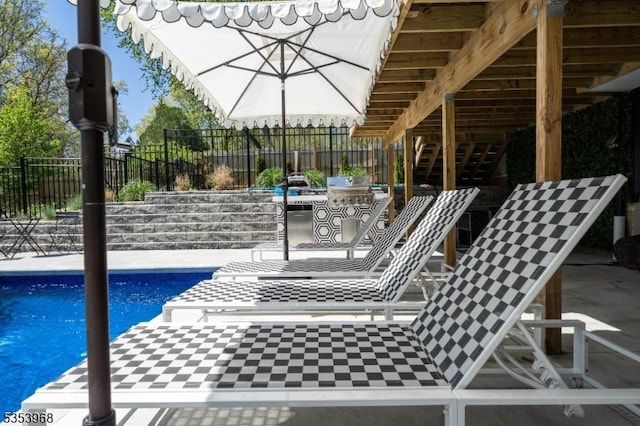 view of swimming pool with a fenced in pool, a patio area, and fence