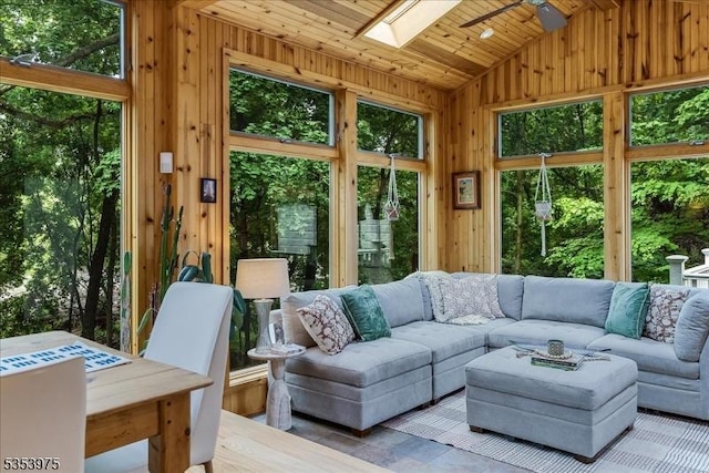 sunroom / solarium with vaulted ceiling and a skylight