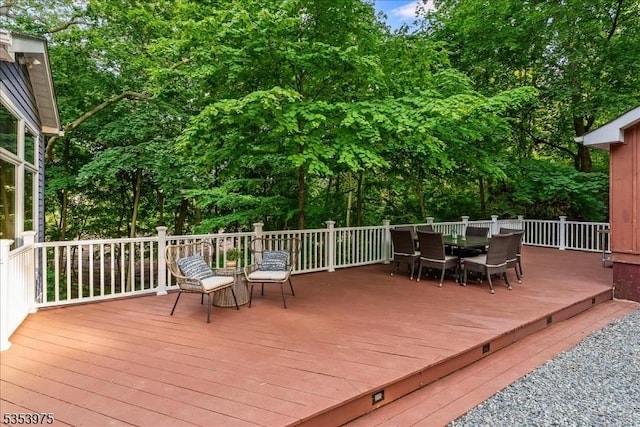 deck with outdoor dining space
