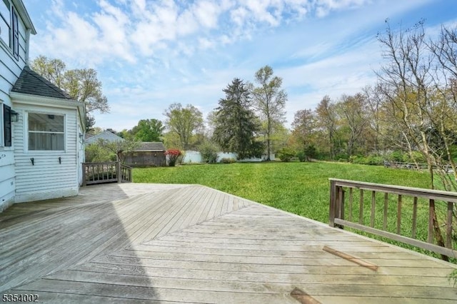 deck featuring a lawn