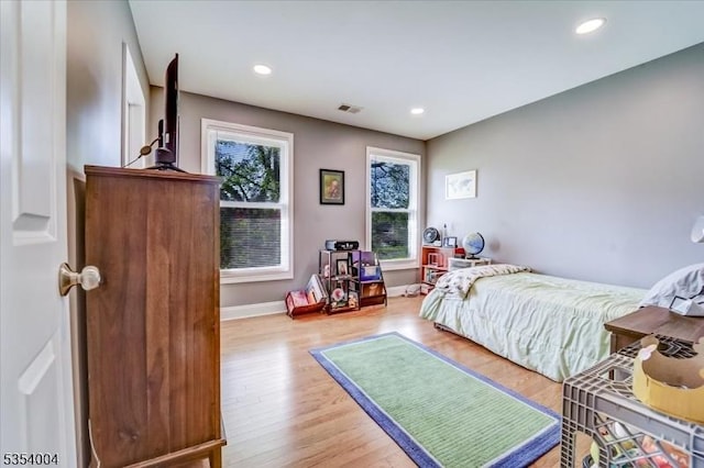 bedroom featuring visible vents, recessed lighting, baseboards, and wood finished floors