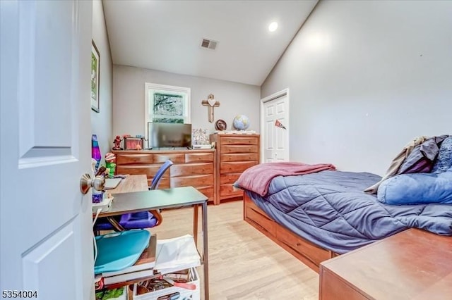 bedroom with recessed lighting, vaulted ceiling, light wood-type flooring, and visible vents