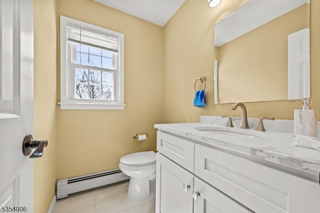 bathroom with vanity, a baseboard radiator, baseboards, and toilet