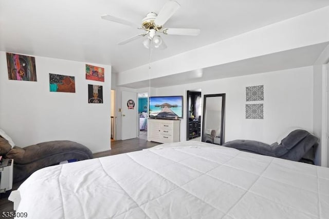 bedroom with ceiling fan and wood finished floors