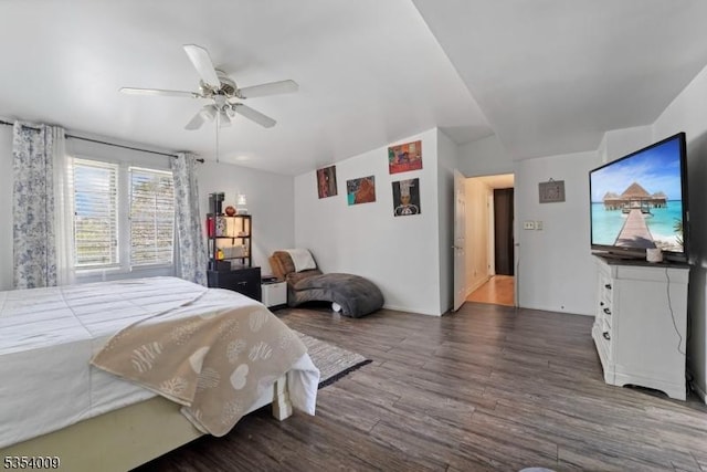 bedroom with ceiling fan and wood finished floors