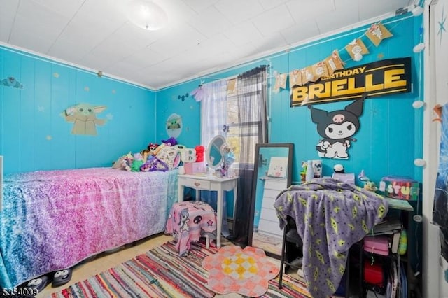 bedroom with ornamental molding